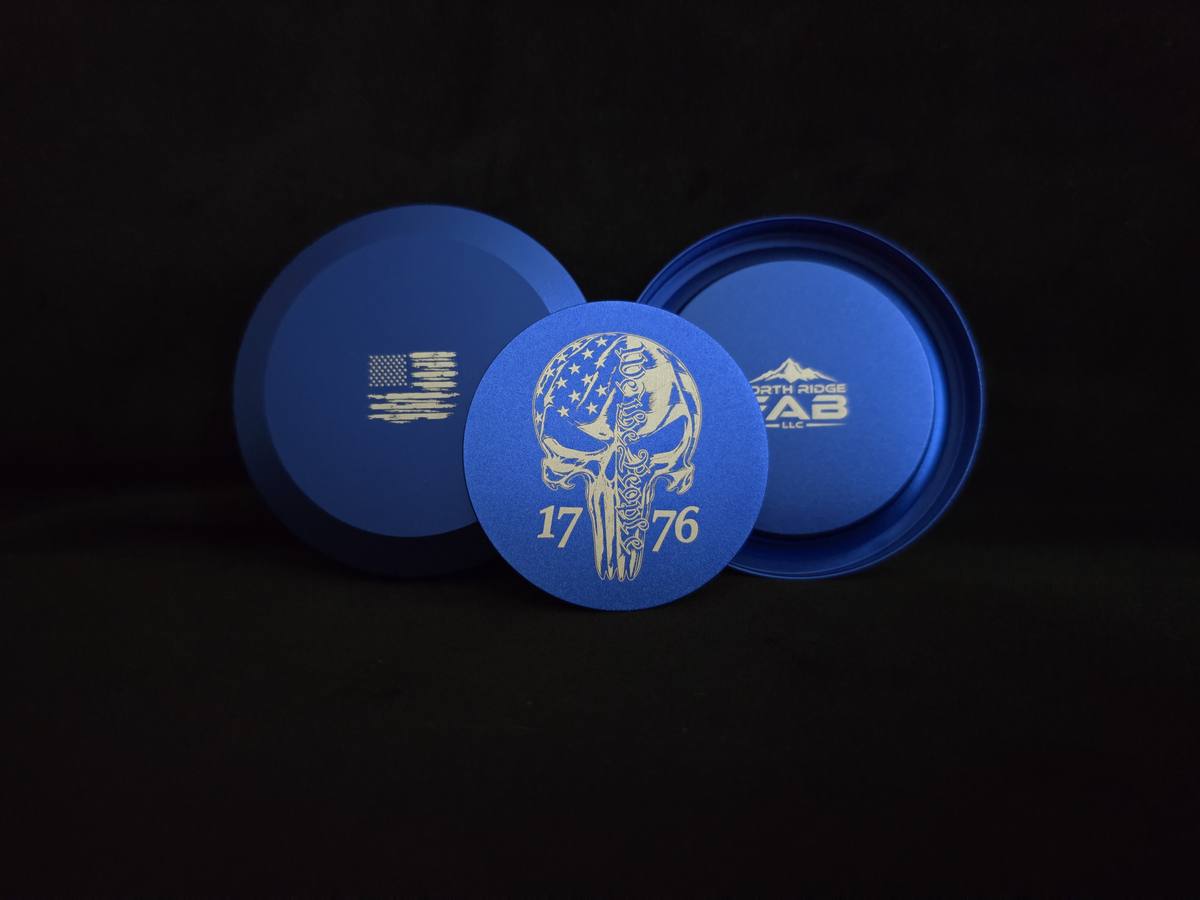 Blue 1776 We The People Skull can — front, flag back, and maker mark