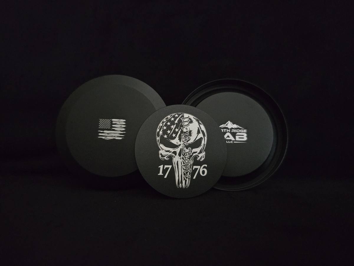 Black 1776 We The People Skull can — front, flag back, and maker mark